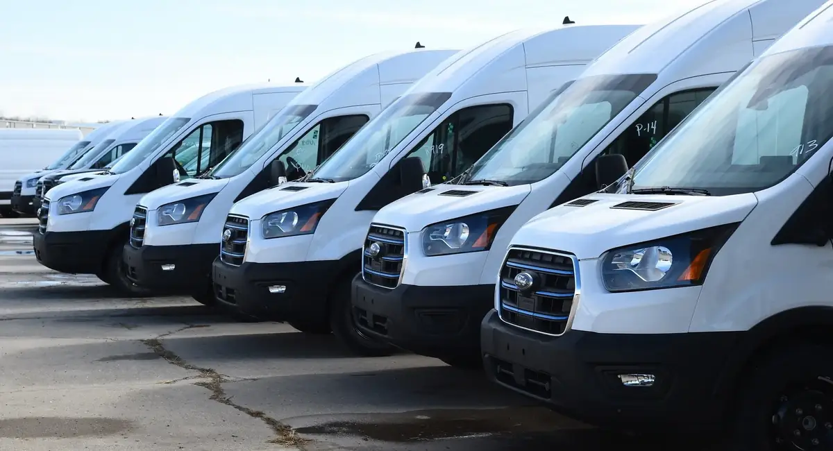 AMCO Delivery fleet of cargo vans lined up ready for Washington courier service